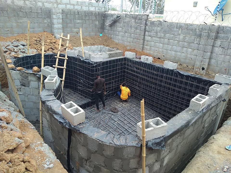 Pool shell with rebar reinforcement and liner system