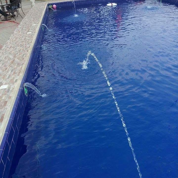 Swimming pool water fountain jets in operation