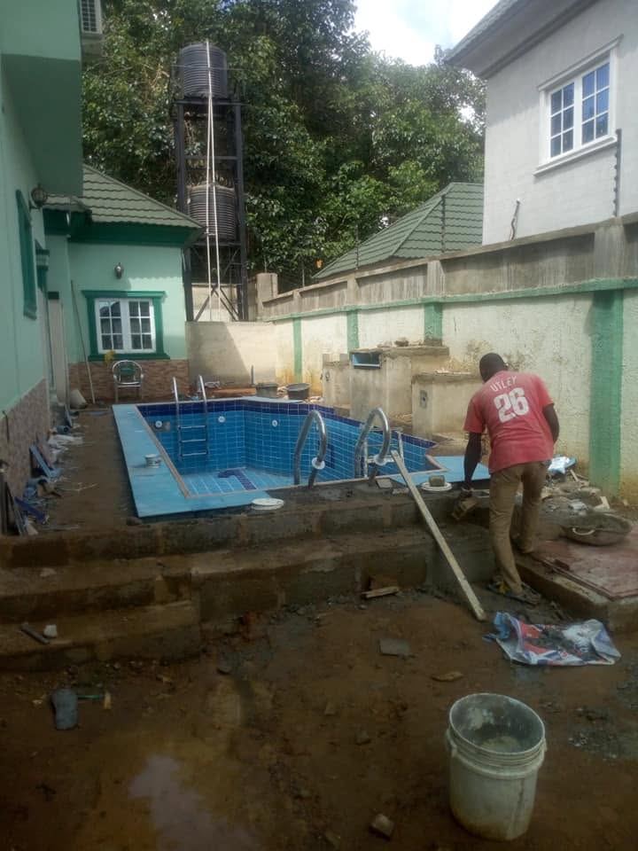 Blue tile swimming pool under construction
